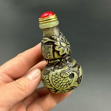 A luminous snuff bottle beautifully carved by hand in ancient China