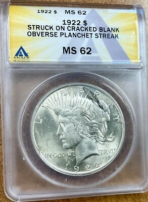 1922 Peace silver dollar  ERROR ANACS MS62 BU cracked planchet w/ metal streak. - Image 1 of 4