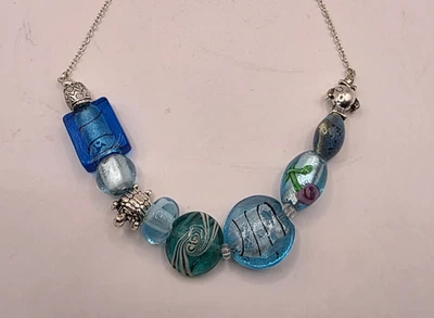 Vintage AVON SAQ Beaded Necklace Blue Lampwork Glass Turtle Fish Silver Charms - Image 1 of 4