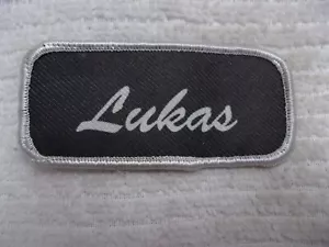 LUKAS GEBRAUCHT SIEBDRUCK VINTAGE AUFNÄHEN NAME PATCH ETIKETTEN WEISS AUF BRAUN - Bild 1 von 2