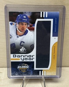 John Tavares 2024-25 UD SP Game Used Banner Year Global Series Maple Leafs - Bild 1 von 2