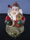 Hand made Santa Claus sitting on a gold metal basket figurine / wall hanging