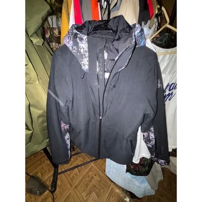 Chaqueta de esquí de nieve de invierno Spyder negra con detalles morados Foto 1 de 4