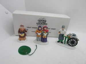 Dept 56 Heritage Village VIOLET VENDOR / CAROLERS / CHESTNUT VENDOR Set of 3 NEW - Imagen 1 de 10