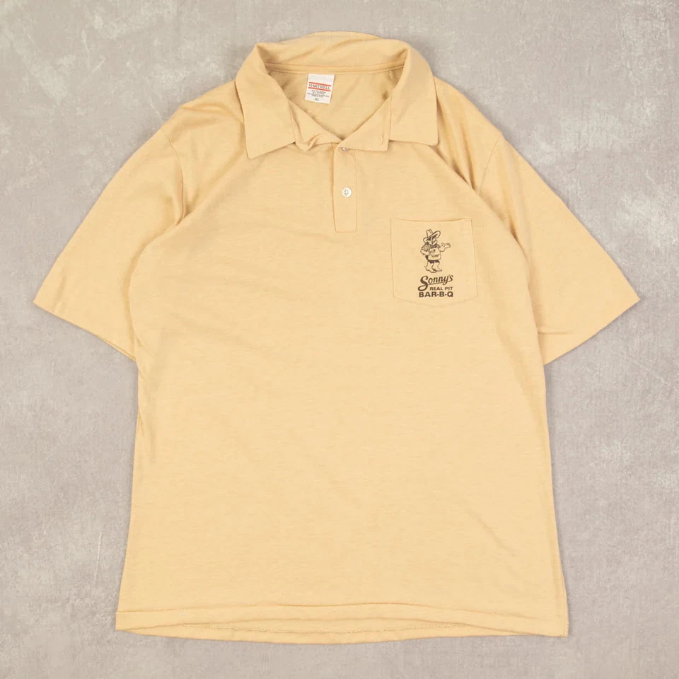 Camiseta polo Hartwell vintage anos 90 Sonny Real Pit Bar-B-Q gráfica GG masculina amarela  - Imagem 1 de 4