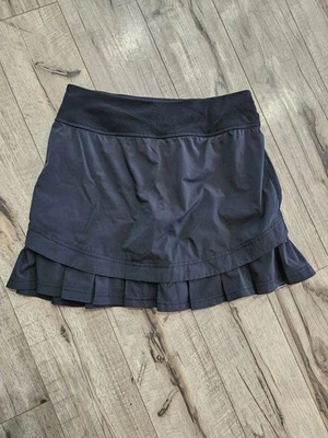 Falda corta forrada Ivivva by Lululemon plisada con volantes niñas 14 negra Foto 1 de 4