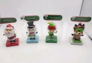 Set Of 4 Christmas House Solar-Powered Dancing Figures In Time For Christmas New - Picture 1 of 3
