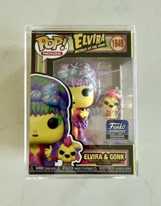 Funko Pop esclusivo firmato Elvira & Gonk Blacklight #1649 - rosa - senza certificato di autenticità - Foto 1 di 3