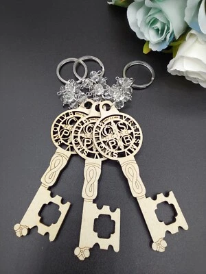 EE. UU. 12 piezas Llavero Forma Lase Recorte para Regalo de Bautizo para con Bolsa de Organza Foto 1 de 4