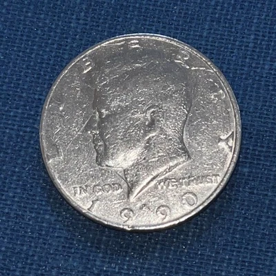 1990 P Kennedy Half Dollar Error Coin Missing it’s Reeded Edge.  - Image 1 of 4