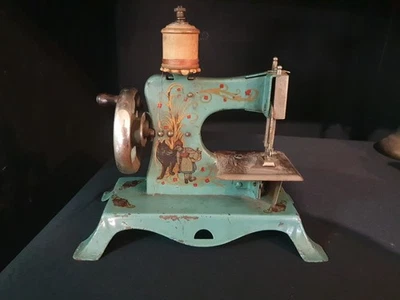 1930'S  CASIGE MINI SEWING MACHINE RARE BLUE-GREEN GERMAN RED RIDING HOOD  - Image 1 of 4