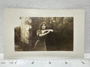Vintage Real Photo Postcard RPPC Beautiful Young Woman Leaning on Clothes Line - Picture 1 of 3
