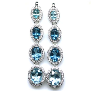 Gemstone 6 x 8 mm. Sky Blue Topaz & Blue - White Zircon Earrings 925 Silver - Picture 1 of 4
