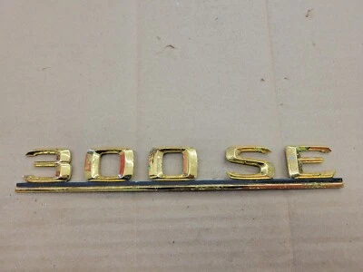 Mercedes OEM 1985-1992 300 SE 300SE New NOS Gold Rear Trunk Emblem Badge Logo - Image 1 of 4