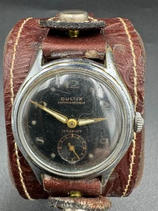 De colección 1950 Dulux Antimagnetique Incabloc esfera negra dorada sujetador rugoso Bund St - Imagen 1 de 24