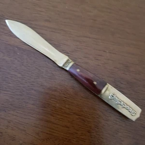 Abridor de letras vintage de latón Singapur - recuerdo Merlion, mango rojo decoración asiática - Imagen 1 de 4