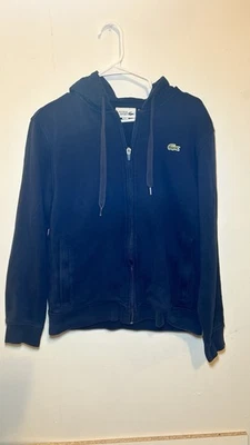 Dark blue jacket with zipper. Features Lacoste crocodile logo. - Image 1 of 4