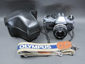 Cámara fotográfica Olympus OM10 plateada 35 mm SLR con lente 50 mm F1,8 [casi como nueva] - Imagen 1 de 17