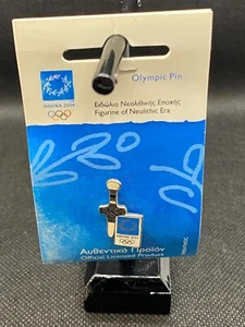 Pin Olímpico de Atenas 2004 con figura de la era neolítica - embalaje original - nuevo - Imagen 1 de 4