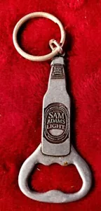 Abrebotellas Metal Cerveza Samuel Adams. Luz y almacén. 3,5" de largo. Llavero - Imagen 1 de 5