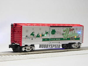 LIONEL CHRISTMAS LIGHT EXPRESS HAPPY HOLIDAYS SOUND BOXCAR O GAUGE 2123100-H NEW - Picture 1 of 6