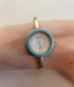 Gucci Gold Tone Thin Band Watch W 16 Changeable Bezel Colors - Picture 1 of 13