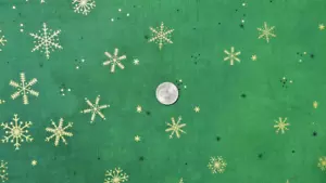 MODA FABRICS 431MG "GREEN OMBRE FLURRIES GOLD METALLIC SNOW FLAKES BTY - Picture 1 of 2