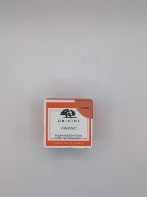 Crema iluminadora de ojos Origins GinZing, 0,5 fl oz, tono cálido Foto 1 de 2