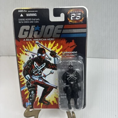 G.I. Figura de acción Joe 25 aniversario Commando Snake Eyes 2007 Foil Night T1 Foto 1 de 3
