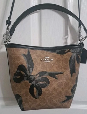 Coach CY651 City Bucket Bag In Signature Canvas with Bow Print Crossbody Tan - Image 1 of 4