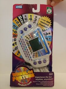 Wheel of Fortune Handheld Electronic Game Pre Owned with package and instruction
