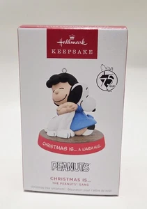 Hallmark Keepsake Ornament 2025 Christmas Is..... A Warm Hug Peanuts - Picture 1 of 5