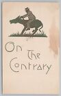 Animal~On The Contrary~Checkered Man Riding Stubborn Donkey~Vintage Postcard