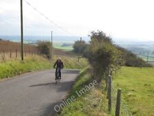Photo 6x4 Cycling up the North Downs Hastingleigh This cyclist had just a c2011
