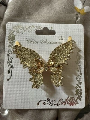 Broche Mariposa chapado en oro con pedrería blanca y cristal marrón claro Foto 1 de 4