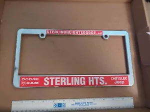 Vintage License plate frame dealership Michigan Sterling Heights Dodge Ram Jeep - Picture 1 of 2