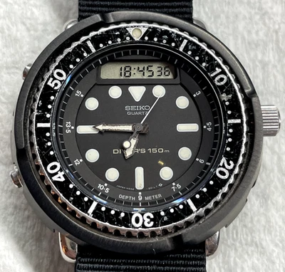 Seiko H558-5009 “Arnie” – Reparado – Nuevo OTAN, Cristal de Zafiro, Cubierta de Acero Foto 1 de 4