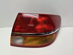 New OEM Saturn Passenger Side Tail Light 19210448 - Picture 1 of 9