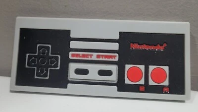 Juguete mordedor de bebé de silicona Bumpkins controlador Nintendo NES texturizado lavable Foto 1 de 3