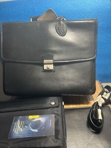 Black leather executive briefcase with shoulder strap and lock. qualitative