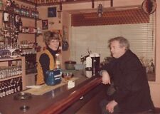 Vintage Found Photo - 1970s - Pretty Bartender Smiles & Serves Man In Ireland