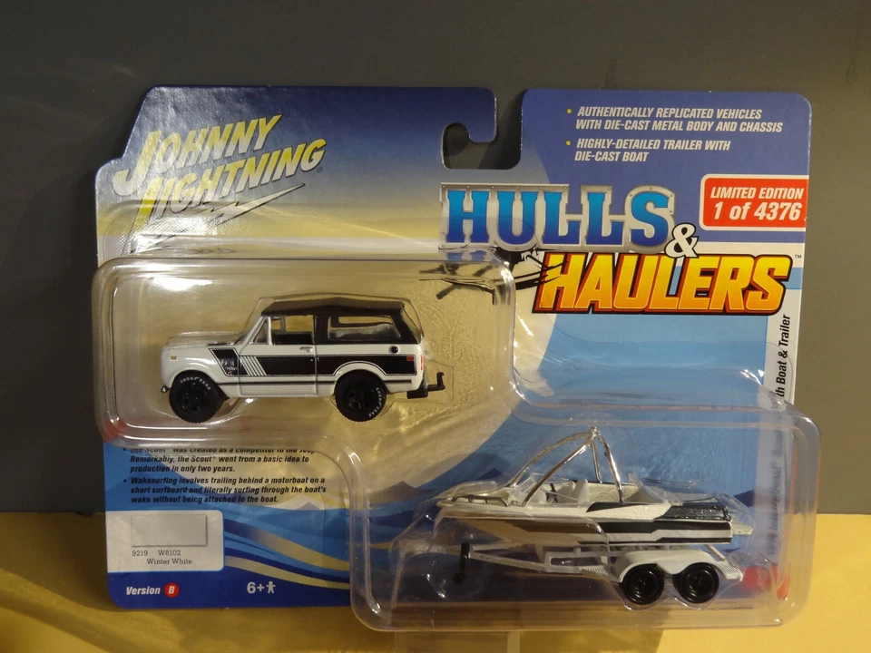 JOHNNY LIGHTNING - WHITE - 1979 INTERNATIONAL SCOUT WITH MALIBU BOAT & TRAILER - Image 1 of 1