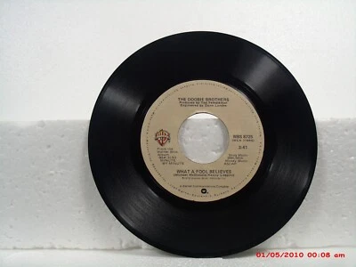 THE DOOBIE BROTHERS-(45)-WHAT A FOOL BELIEVES/DON'T STOP TO WATCH THE WHEELS1978 - Image 1 of 2