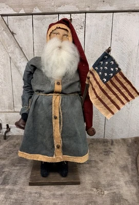 Authentic Arnett’s Folk Art Santa Tall Blue  Coat Bell & Flag - Image 1 of 4