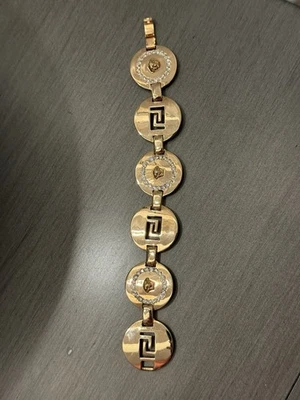 Pulsera de eslabones Versace Medusa y llave griega tono dorado con detalles de cristal Foto 1 de 2