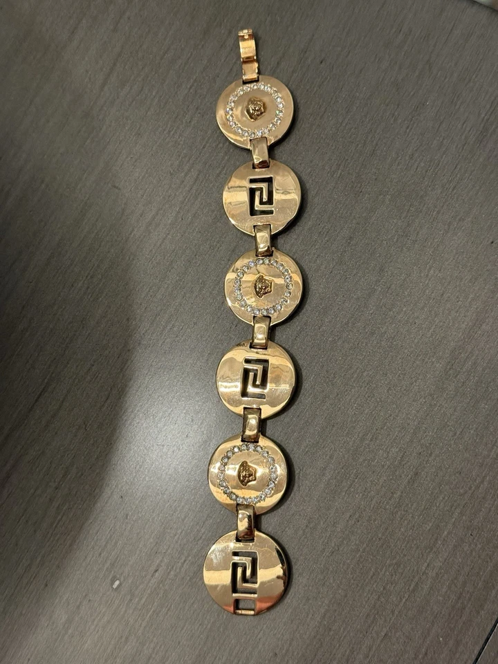Pulsera de eslabones Versace Medusa y llave griega tono dorado con detalles de cristal Foto 1 de 2