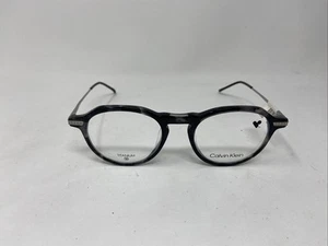 GAFAS CALVIN KLEIN TITANIO CK23532 025 48-19-145 GRIS PLATA -Z71 - Imagen 1 de 6