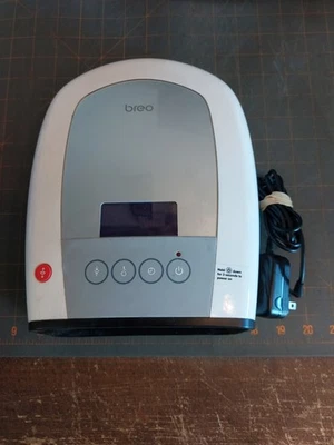 Masajeador de palma eléctrico de mano Breo iPalm 520 blanco plata presión de aire Foto 1 de 4