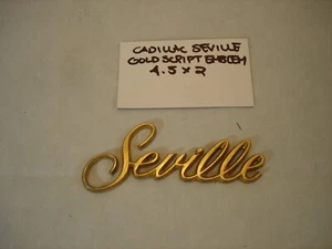 CADILLAC SEVILLE GOLD PLASTIC OEM SCRIPT EMBLEM - 4.5 X 2 - Picture 1 of 2