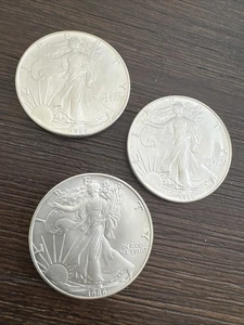 Lot of 3 - 1986 $1 American Silver Eagles - 1 Oz - 99.9% Verified - Lot 86-22 - Picture 1 of 23